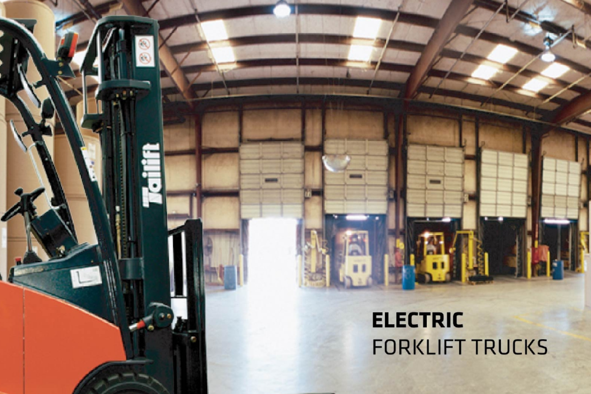 An open warehouse with large doors features multiple yellow forklifts lined up inside. The foreground shows a close-up of an electric forklift, partially cropped, with the brand "Tailift" visible. Text reads "ELECTRIC FORKLIFT TRUCKS.